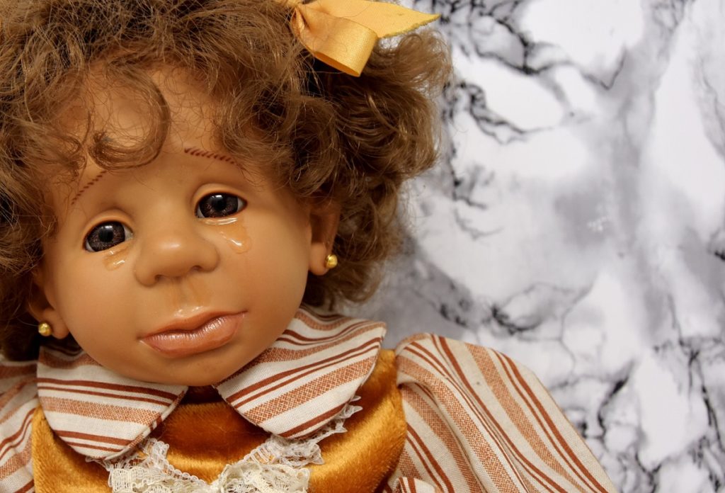 crying doll, to illustrate mourning over the loss of in-person church services
